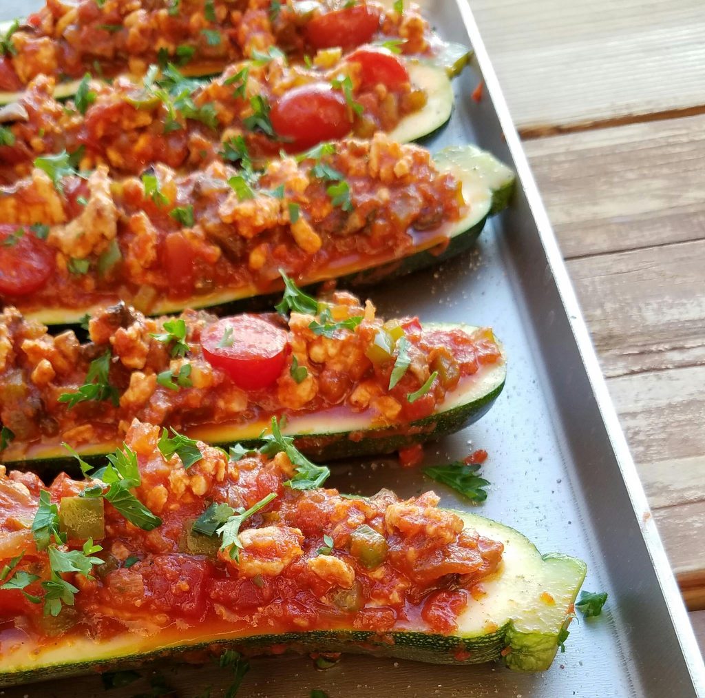 CleanFoodCrush Italian Stuffed Zucchini Recipe https://cleanfoodcrush.com/italian-stuffed-zucchini/