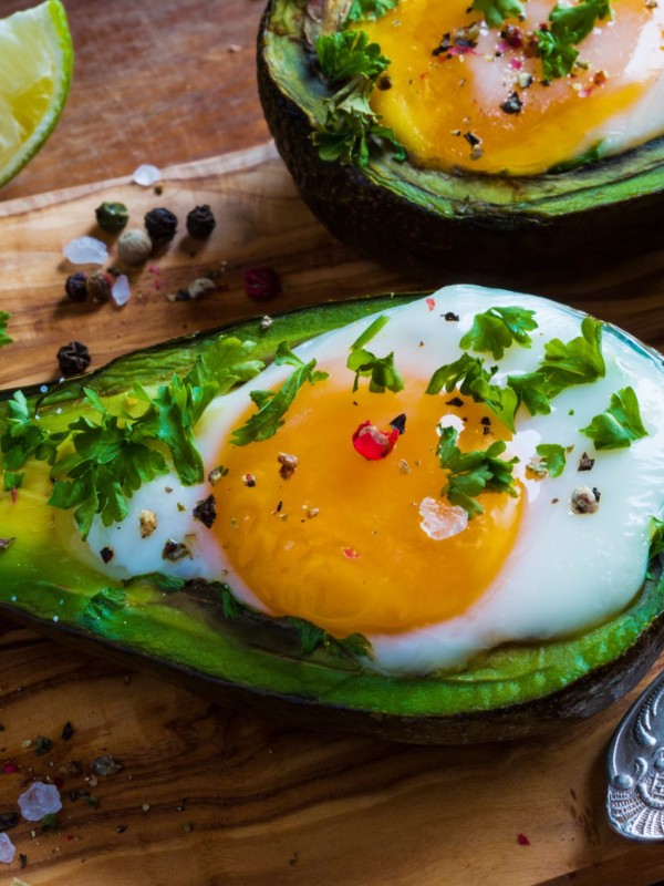 Avocado topped with egg and spring onions