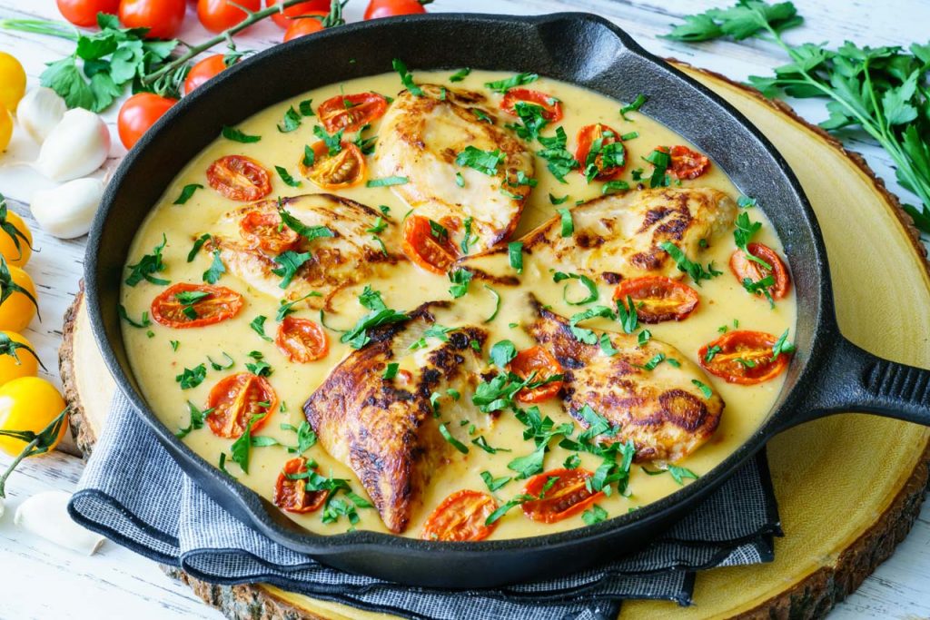 Creamy chicken skillet with tomatoes and basil