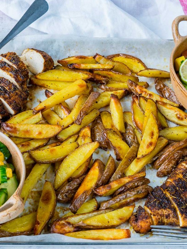 Clean Eating Sheet Pan Jerk Chicken with Baked Fries + Fresh Mango Salsa