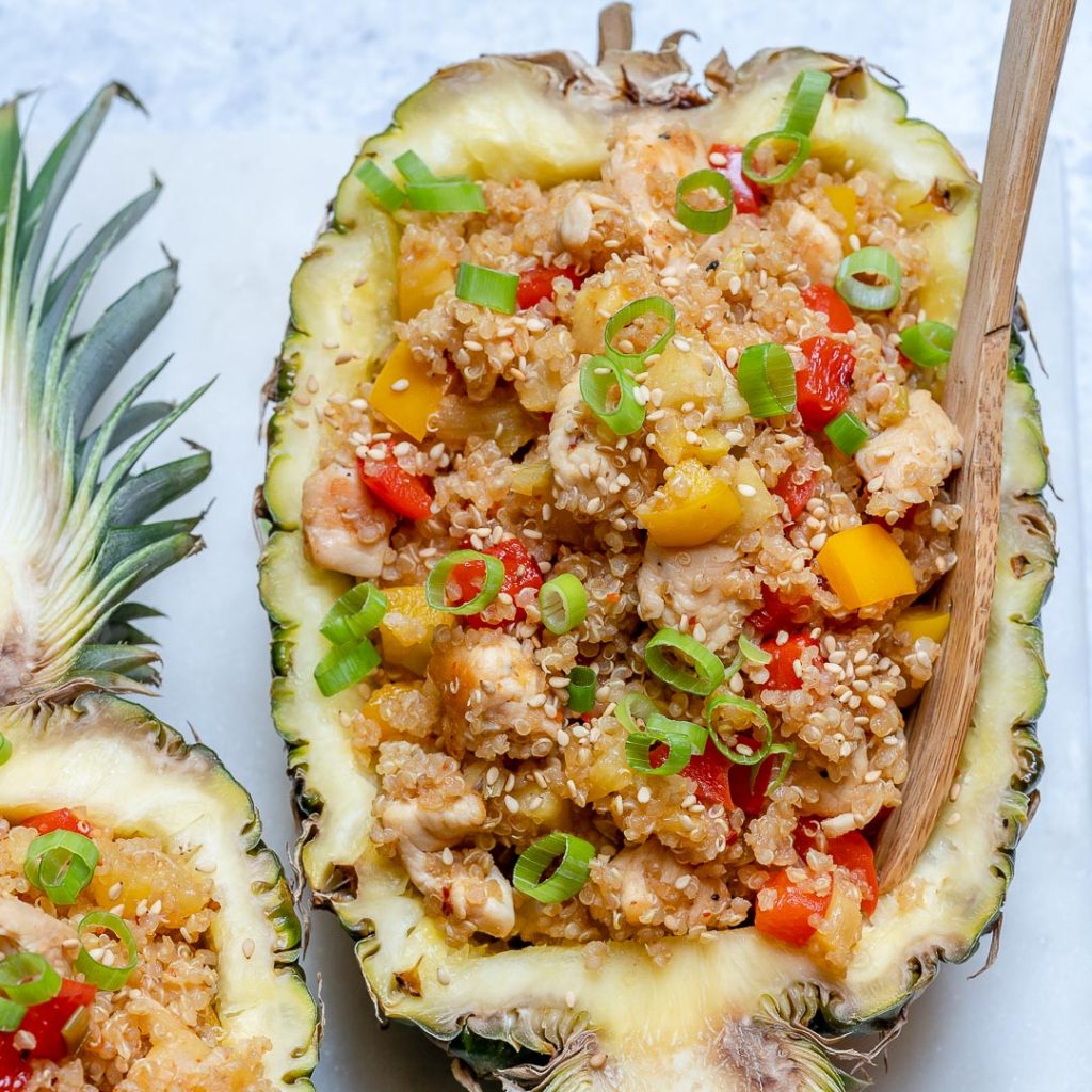 Pineapple chicken bowls for a healthy lunch of chicken and quinoa stuffed pineapples.