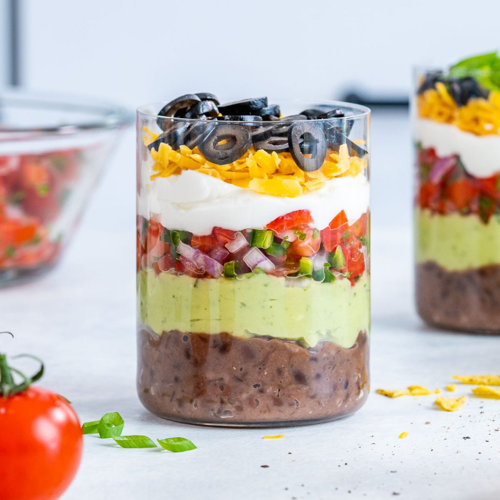 Layers in seven layer dip cups.