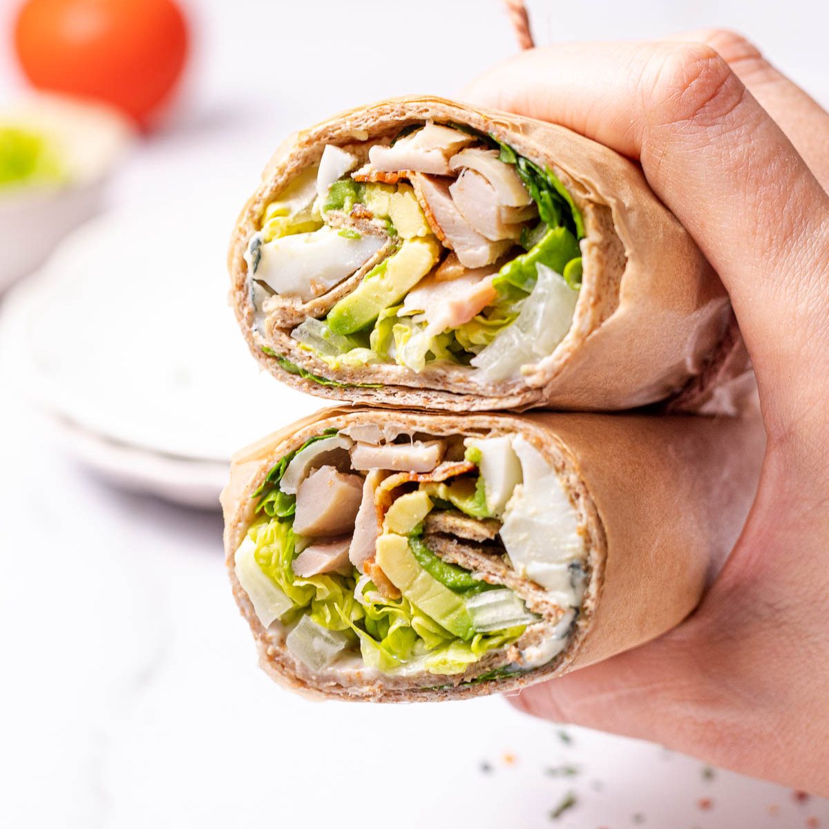 https://cleanfoodcrush.com/wp-content/uploads/2022/12/Leftover-Turkey-Cobb-Salad-Wraps-1200x1200.jpg