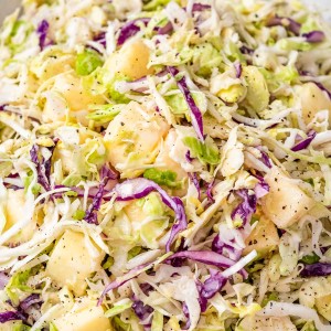 Close up picture of creamy brussels sprout coleslaw with apples