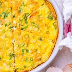 Sweet potato crust quiche in a white dish and cut into slices.