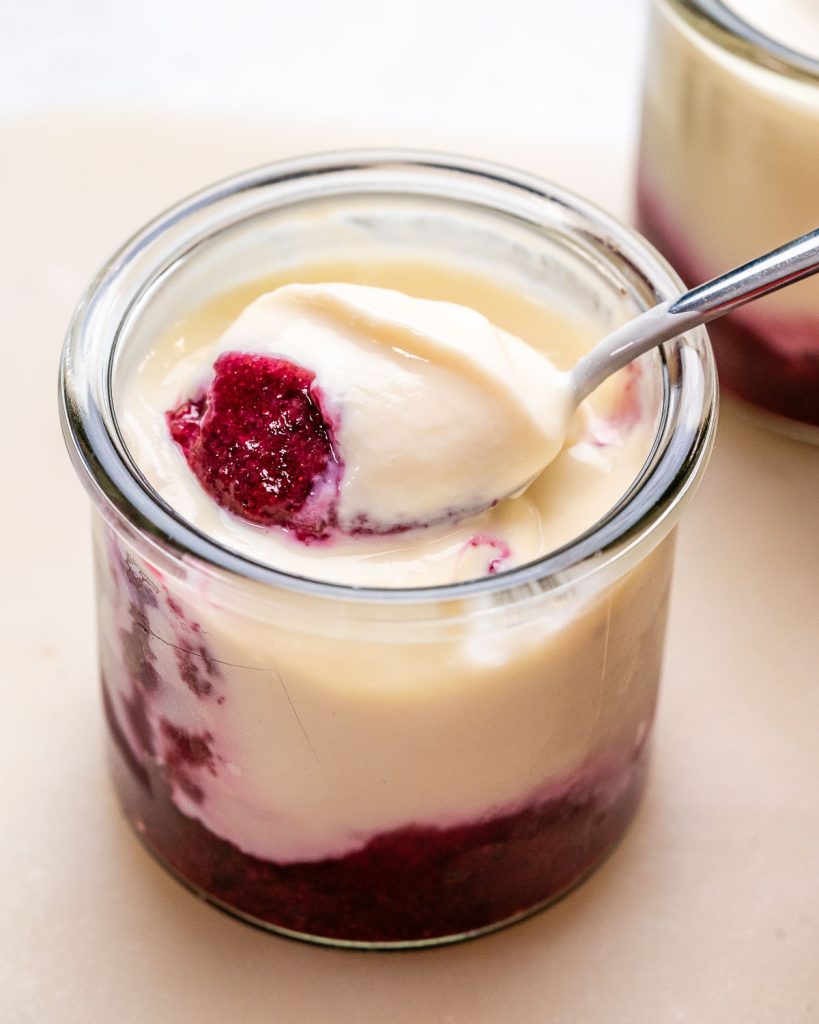 No-bake cottage cheese cheesecake cups with berry and chia seed puree.